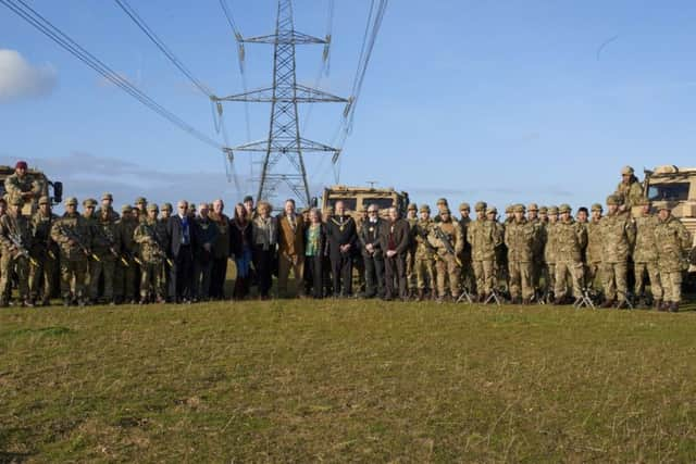 All of the mayors and soldiers pose for a group picture