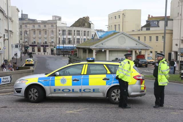 Police guarding the cordon. Photo by Eddie Mitchell