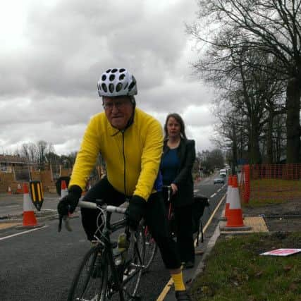 Cyclists demonstrate the width of new cycling lanes in Parsonage Road,  Horsham