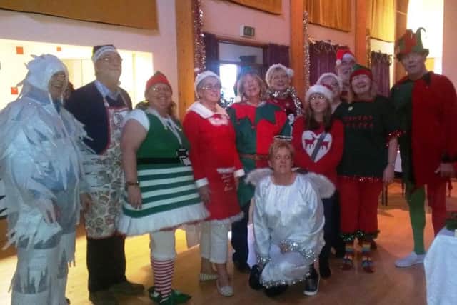 Volunteers at Oving Jubilee Hall for the Christmas lunch party
