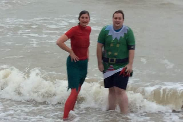 Standing at the water's edge on Worthing beach