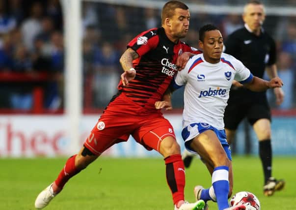 Crawley's Jimmy Smith battles with Portsmouth's Kyle Bennett during Crawley Town v Portsmouth, Sky Bet League Two, Broadfield Stadium, Crawley, England, 18th August, 2015. PPP-150818-201031006