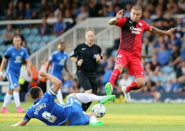 Michael Bostwick of Peterborough United tackles Jimmy Smith of Crawley Town - Mandatory byline: Joe Dent/JMP - 07966386802 - 11/08/2015 - FOOTBALL - ABAX Stadium -Peterborough,England - Peterborough United v Crawley Town - Capital One Cup EMN-150813-122854002