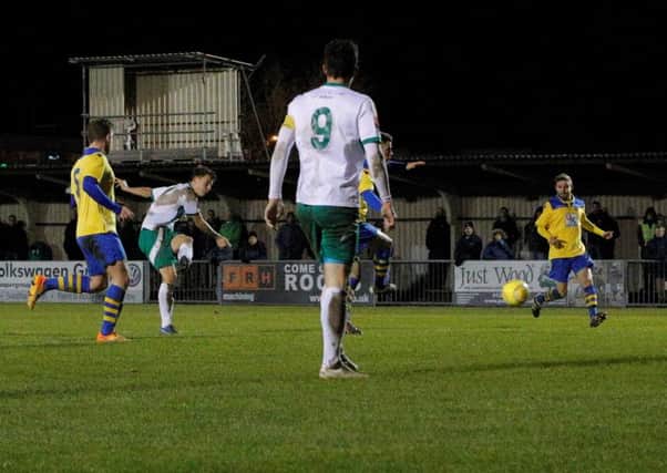 Alfie Rutherford scores his second against Eastbourne Town / Picture by Tim Hale
