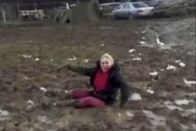 Sara Coull, 48, from East Sussex when she was stuck in the mud and filmed falling over. Photo from SWNS. SUS-160113-150359001