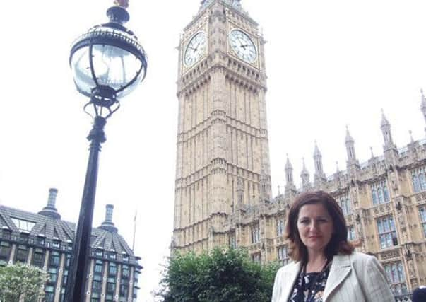 Eastbourne MP Caroline Ansell outside Houses of Parliament SUS-150722-141636001