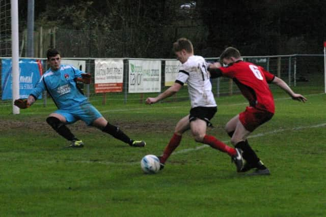 Horsham YMCA's  Phil Johnson (centre) hunting for a brace. Photo by Clive Turner