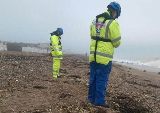 Council workers clearing oil from the beach front SUS-160126-145643001