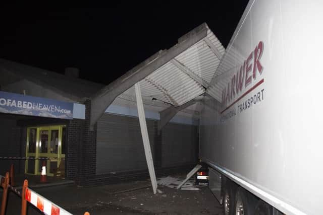 Lorry stuck under shop canopy in Wick Street, Littlehampton