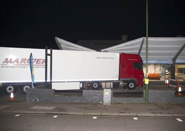 Lorry stuck under shop canopy in Wick Street, Littlehampton