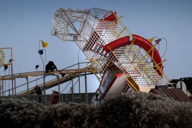 Helter Skelter on Hastings seafront leaning over after being battered by high winds