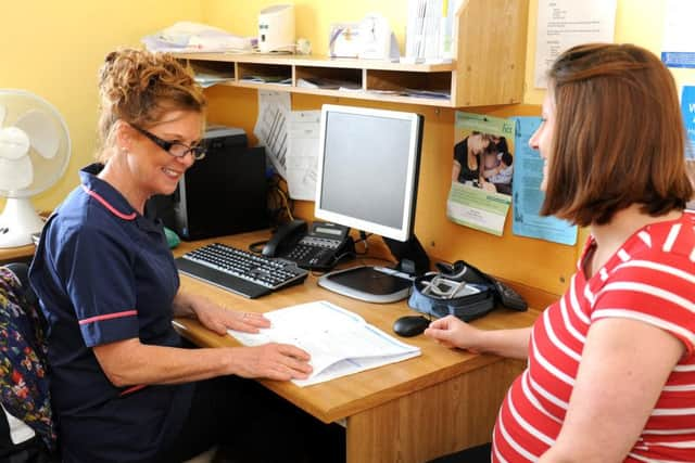 Midwife Carolyn Hay is retiring after serving the Horsham and Crawley districts for many years. Pictured here with Dona Stevens (correct).  SR1604170 SUS-160902-143303001