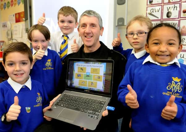 Our Lady Queen of Heaven held an eSafety Day to help the children protect themselves while online. The local community support officer PC Pearce took them through activities. Pic Steve Robards  SR1604152 SUS-160902-160559001