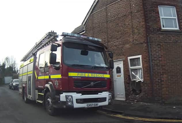 A car crashed into the front of a house in Uckfield. Photo by Nick Fontana. SUS-160902-181736001