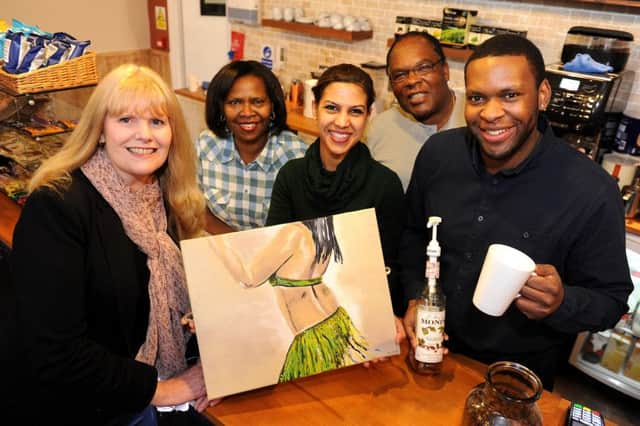 The Broadway Blazian Lounge its been opened by a young couple Adrian and Sushmita. Vanessa Cumper (left) is working with the Crawley Arts Society to get artists' work on display in the cafe, also pictured are Adrian's parents. Pic Steve Robards  SR1604514 SUS-160215-111121001