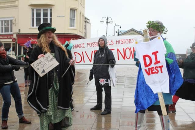 Fossil Free Hastings stage a tug of war between fossil fuel industriesand the climate in Hastings. Photo by Sarah Macbeth