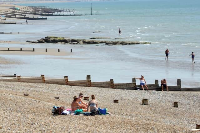 18/7/13- People enjoying the summer sun on Bexhill Beach. ENGSUS00120130718135157