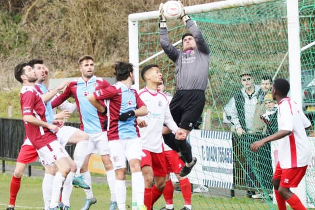 Whitstable Town goalkeeper Dan Eason claims a cross during the 6-1 defeat to Hastings United on Saturday. Picture courtesy Joe Knight