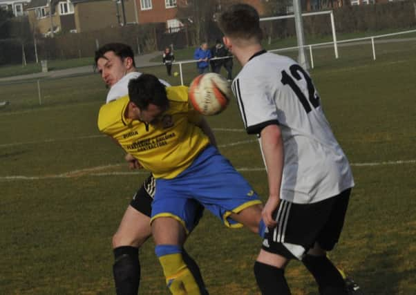 Bexhill United midfielder Josh Elliott-Noye challenges for possession (SUS-161203-221501002)