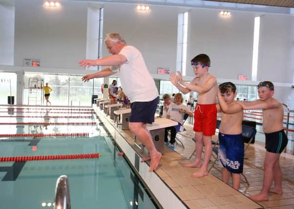 Worthing mayor Michael Donin jumps in with a little help from Leo Jackson, Nathan Albon and his brother Joseph. Picture: Derek Martin DM1616182a