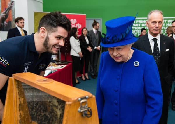 Peter Higgs of Ewhurst company BeeGone meets Queen Elizabeth II