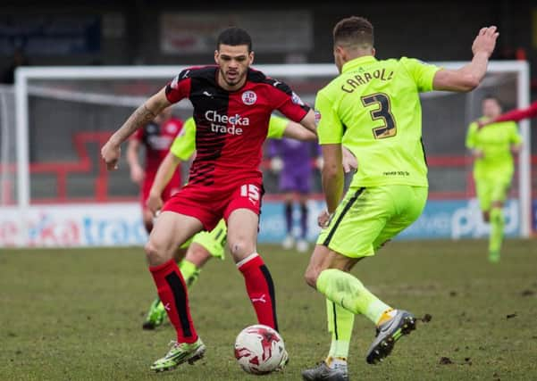 Shamir Fenelon fights for the ball for Crawley Town against Huddersfield Town, 5th March 2016. (c) Jack Beard SUS-160319-175827008