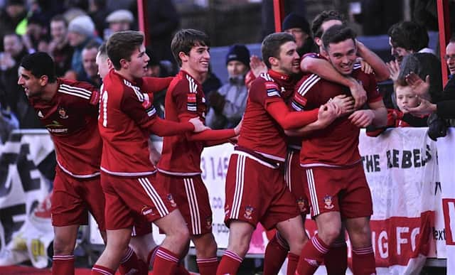 Rebels celebrate earlier this season