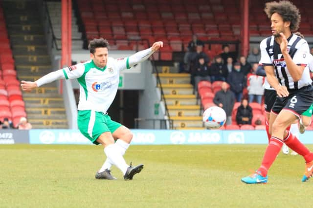 Alex Parsons gets in a cross at Grimsby / Picture by Tim Hale