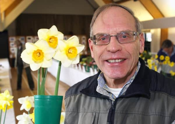 DM1617412a Yapton Cottage Gardeners Society show secretary David Donovan with his first prize winning daffodils