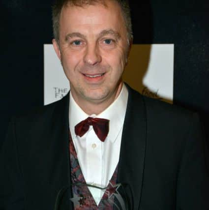 Daniel Gilmore with his Top Teacher award. Photo by David Sawyer.