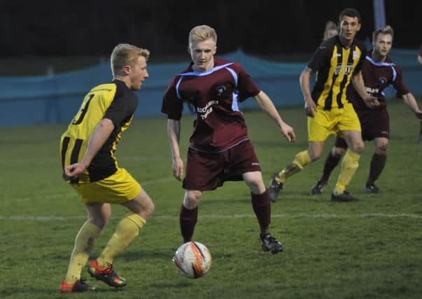 Little Common midfielder Liam Foster keeps a close eye on Southwick forward Ross Myers (SUS-160604-093128002)