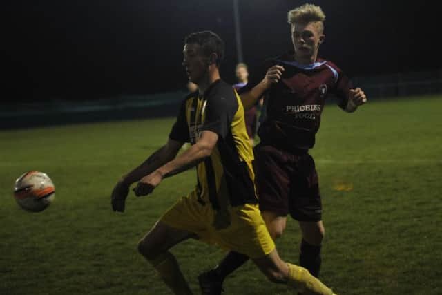 Little Common midfielder Cam Burgon challenges a Southwick opponent (SUS-160604-093245002)