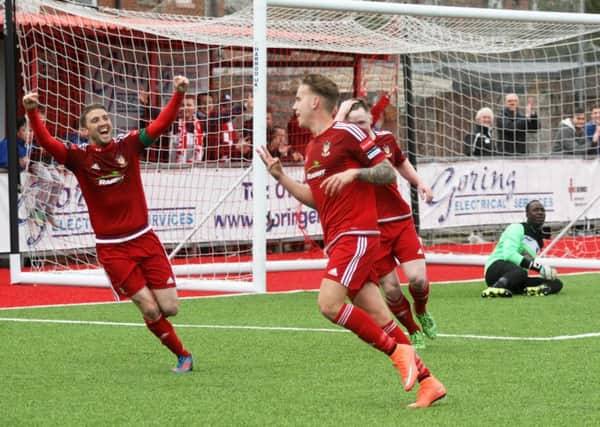 Rebels celebrate a goal