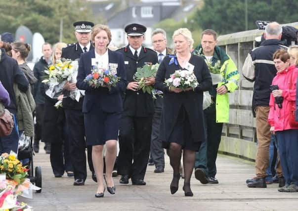 Tributes laid at the Old Toll Bridge in Shoreham, which became a focal point for memorials after the crash. Picture by Eddie Mitchell