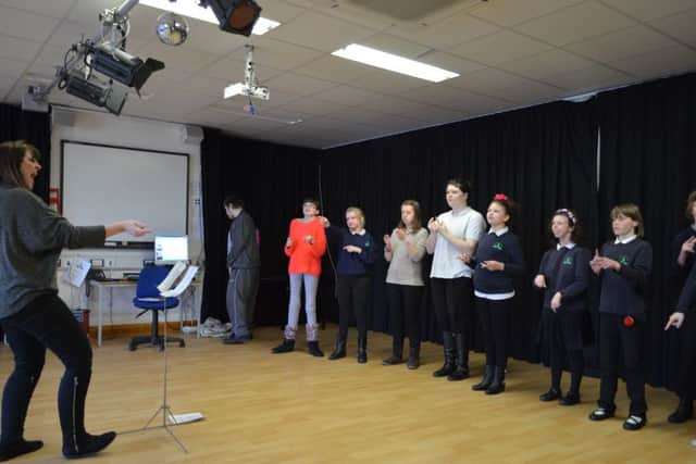 Oak Grove College Signing Choir shows its appreciation by singing and signing