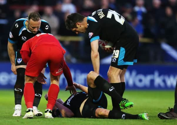 Adam Webster lies stricken on the Bootham Crescent turf. Picture: Joe Pepler