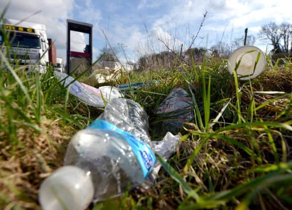 Road side rubbish Ashcombe roundabout SUS-160225-004401008