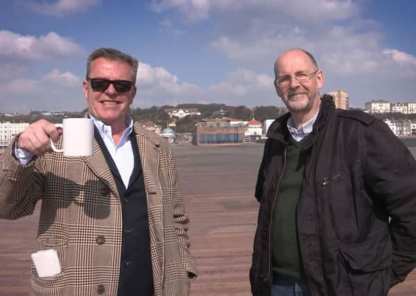 Suggs, from Madness, nailing the last plank on Hastings Pier in March. SUS-160322-142656001