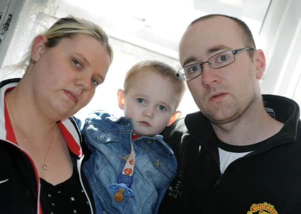 Stephanie and Ian Elliot with their two-year-old son, Robert. SUS-160426-102721001