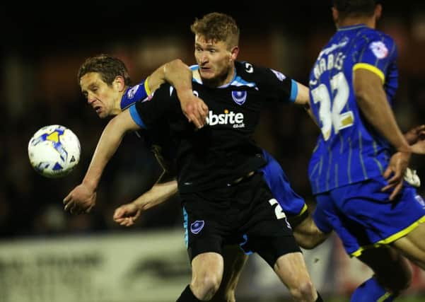 Pompey goal hero Michael Smith tussles with former Blues defender Paul Robinson. Picture: Joe Pepler