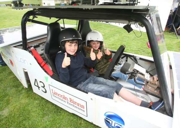 DM16116876a.jpg STEMfest, Memorial Gardens, Crawley. Thomas Farrow 11 and his sister Amelie 8. Photo by Derek Martin SUS-160514-201117008