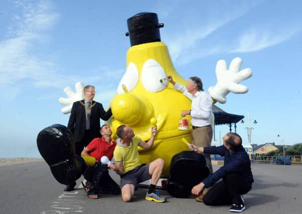 Billy with the team who helped revive him, L-R Paul Wells, the mayor, Darrell Hardy, caretaker of the model and painter, Greg Burt, secretary of Bognor Regis seafront lights, Jim Price, the son of the original designer, and Tim Hoad, who instigated the campaign. Picture by Kate Shemilt