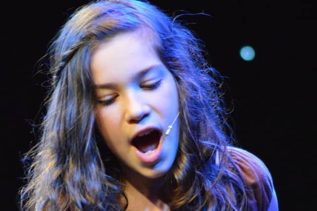 Pupils at Summerlea Community Primary Schools Glee Club took over The Windmill Theatre. Esti Parkin, from year six, performs.