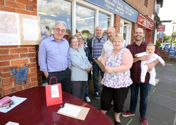 Angmering action group against proposed traffic scheme. Organisers John Turner and his wife Pat far left and supporters. Photo by Derek Martin. SUS-160523-201951008