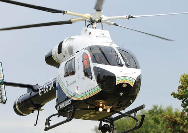 JPCT 100913 Air Ambulance lands on Pulborough recreation ground. Photo by Derek Martin SUS-141106-154431001