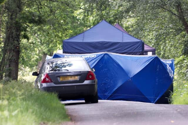 Forensics teams at the site where human remains have been found on Hampshire Hill in Slaugham. Picture: Eddie Mitchell