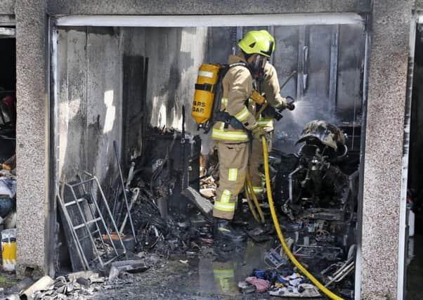 Fire crews deal with a garage fire in Worthing. Picture: Eddie Mitchell