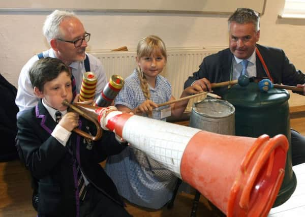 DM1515495a.jpg Eco summit at Shoreham College. Heateacher Richard Taylor-West and Tim Loughton join a music making work shop. Photo by Derek Martin SUS-150713-165507008