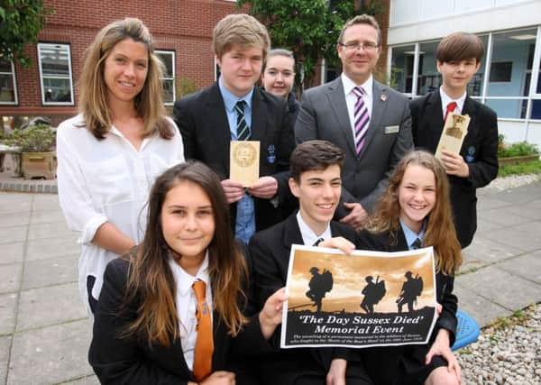 Chatsmore Catholic High School teacher Caroline Woodward with assistant head Julian Morgan and pupils