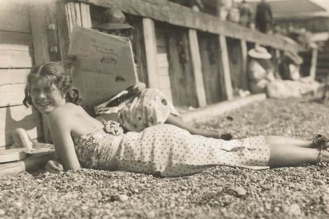 Joan enjoying the sunshine as a youngster